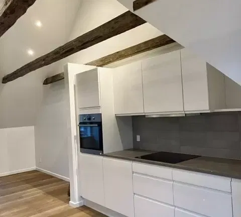 apartment Bright 3-room attic apartment with exposed beams and modern kitchen – 50 m²